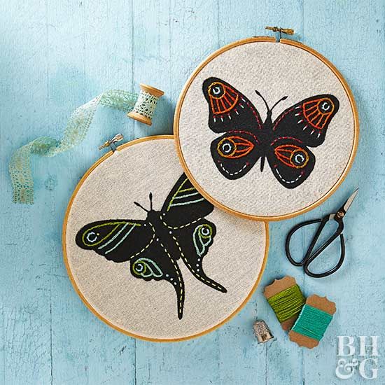 This embroidered art lets colorful stitching glow against a black butterfly or m...