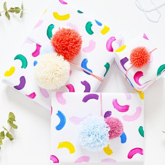 Learn how to make this easy colorful gift wrap in 10 minutes and top it with a c...