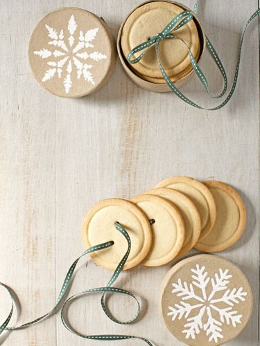 Present these sugar-cookie buttons by gathering a stack together and threading r...