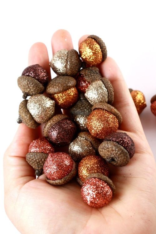 Glitter acorns. Good vase filler for a fall wedding :)