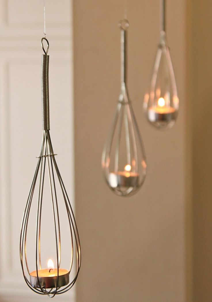DIY: Tealights in hung whisks. Sweet idea.