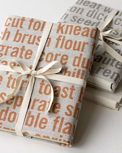 Wrap a cookbook with tea towels from Studiopatró. 2 gifts-in-1.