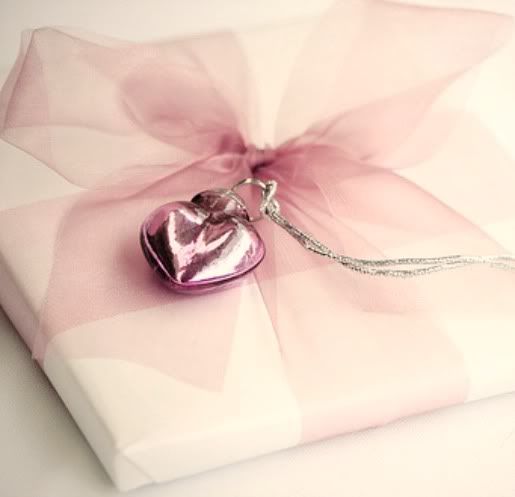 pale pink tulle or organza bow ...tie a sweet charm on to finish it off