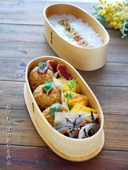 Croquette (fried potato and salmon), omelette, hijiki seaweed and lotus root, pe...