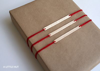 Popsicle stick gift tags. Imagine if you painted them gold or silver!