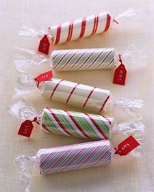 Wrap a toilet paper roll in gift wrap, insert gift inside, wrap in cellophane, a...