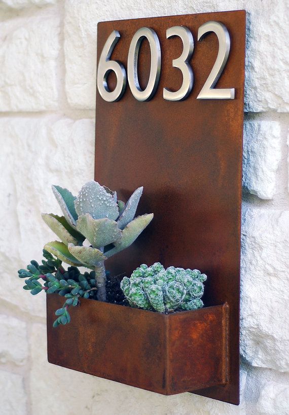This modern address plaque and wall planter adds flair and style to the facade o...