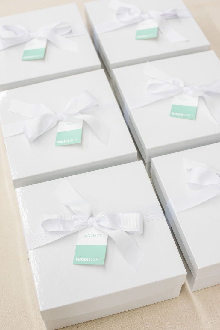 CORPORATE EVENT GIFTS// White and pastel company gift boxes are custom designed ...