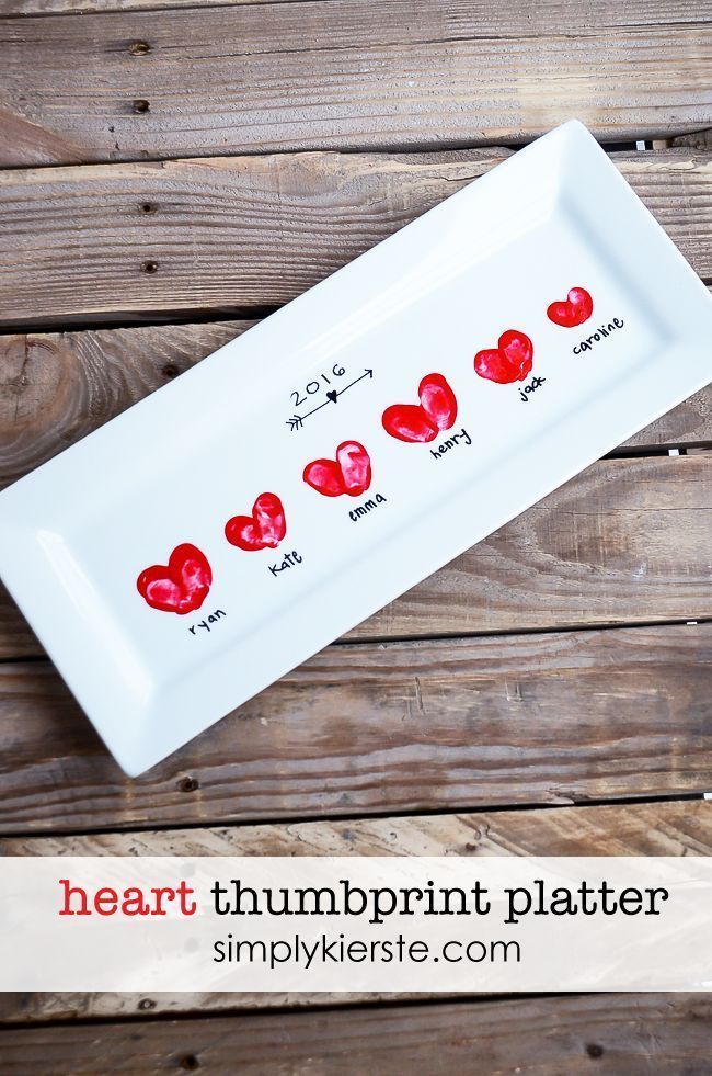 Add your children's fingerprints in the shape of heart onto a white serving plat...