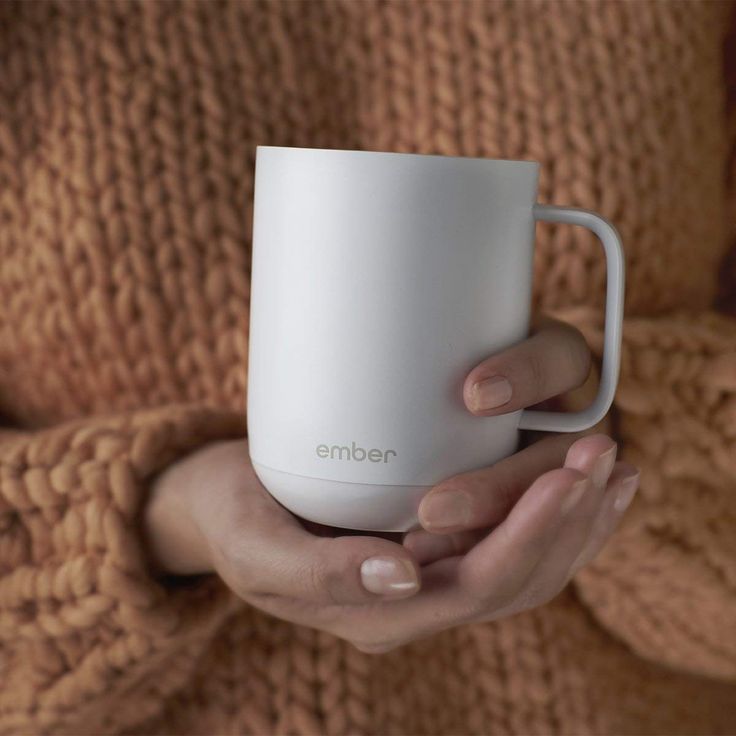 The Ember Temperature Control ceramic mug keeps your beverage HOT using your pho...