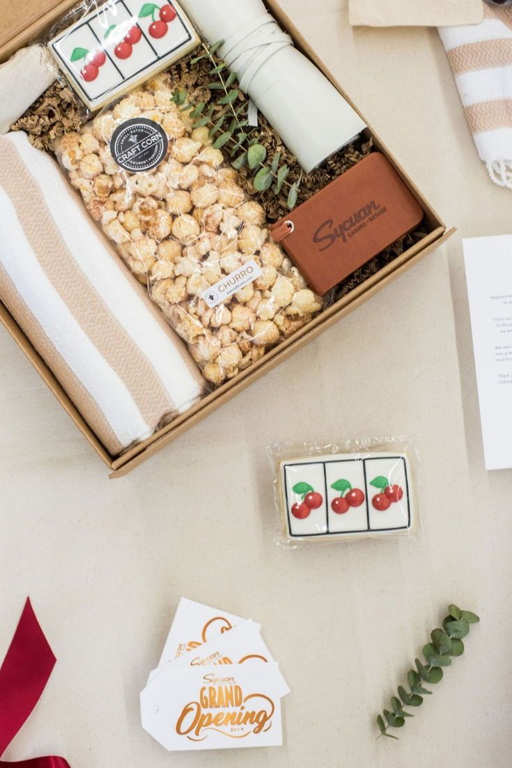 CORPORATE EVENT GIFTS// Beige and cherry red company gifts welcome casino guests...