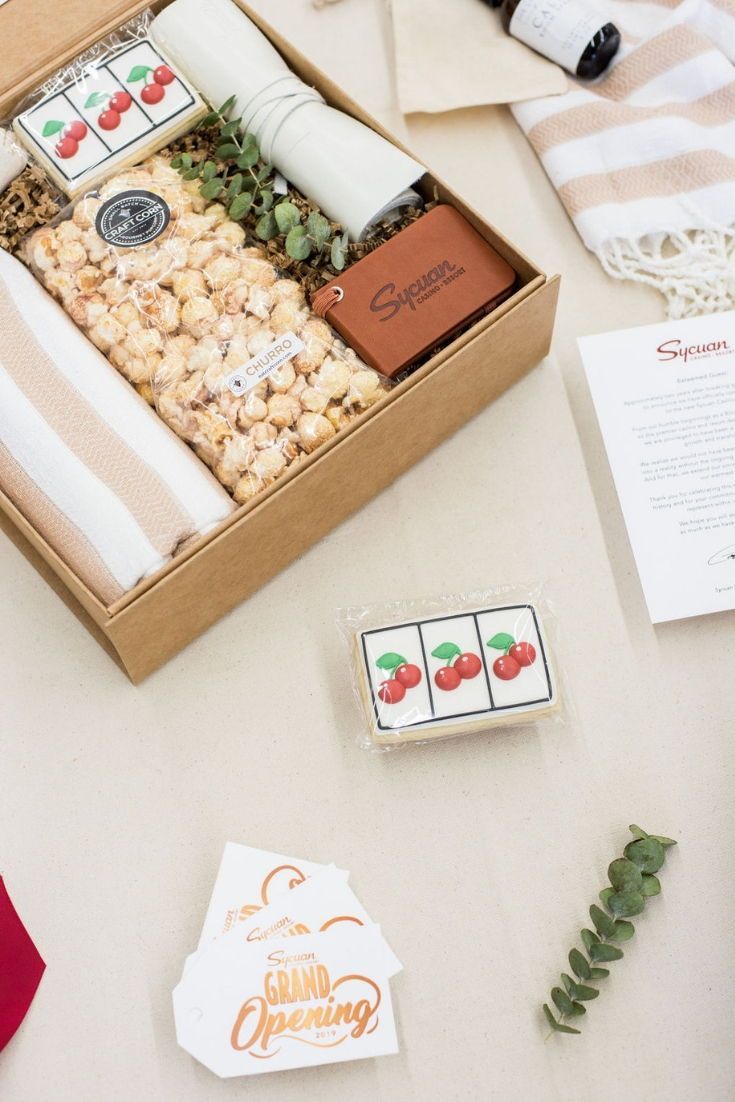 CORPORATE EVENT GIFTS// Beige and cherry red company gifts welcome casino guests...