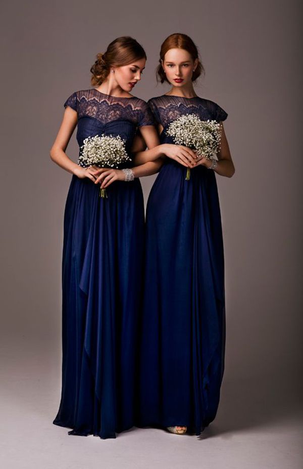 The perfect fall bridesmaids dress? We think so! The navy blue color and lace ne...