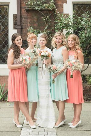 love the babys breath with hits of coral for bridesmaid...e