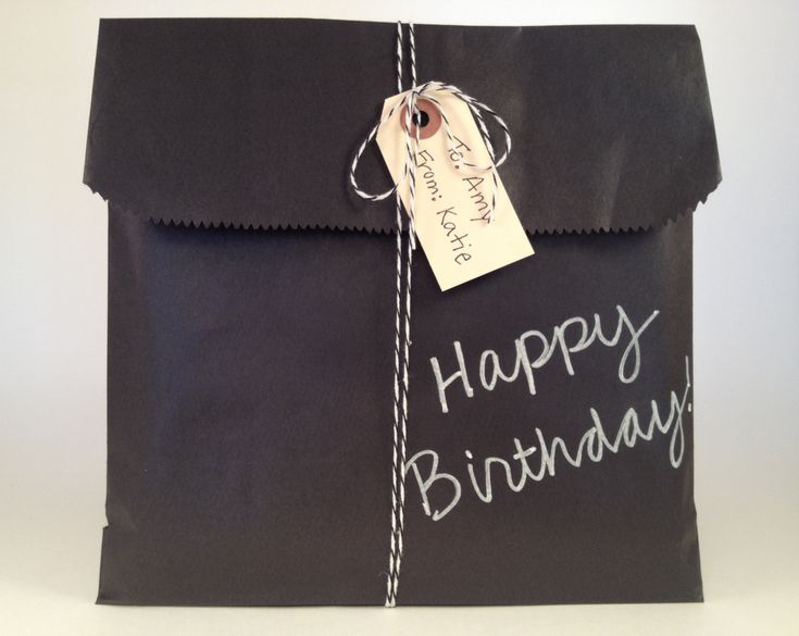 Black kraft bags you can write on with a chalk pen.  Cute gift wrapping for Chri...