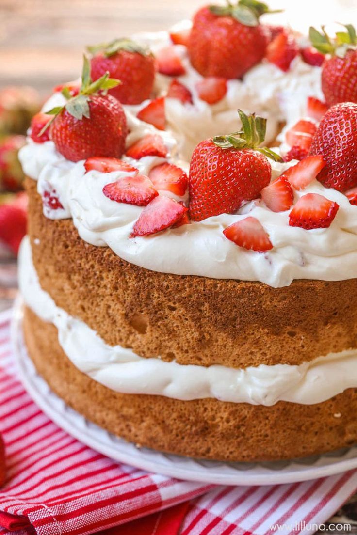 Mom will love this light angel food cake topped with a creamy strawberry frostin...