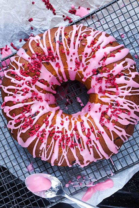 Raspberry and Rose Bundt Cake:  Drizzle pink glaze icing and dried raspberries a...