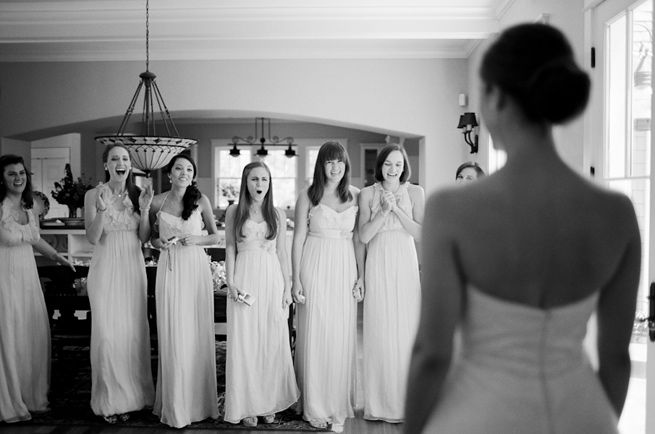 Bridesmaids seeing the bride all together for the first time. That's pretty ...