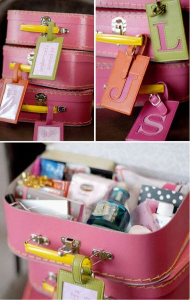 Pink suitcases filled with gifts for bridesmaids, but they could be used for any...