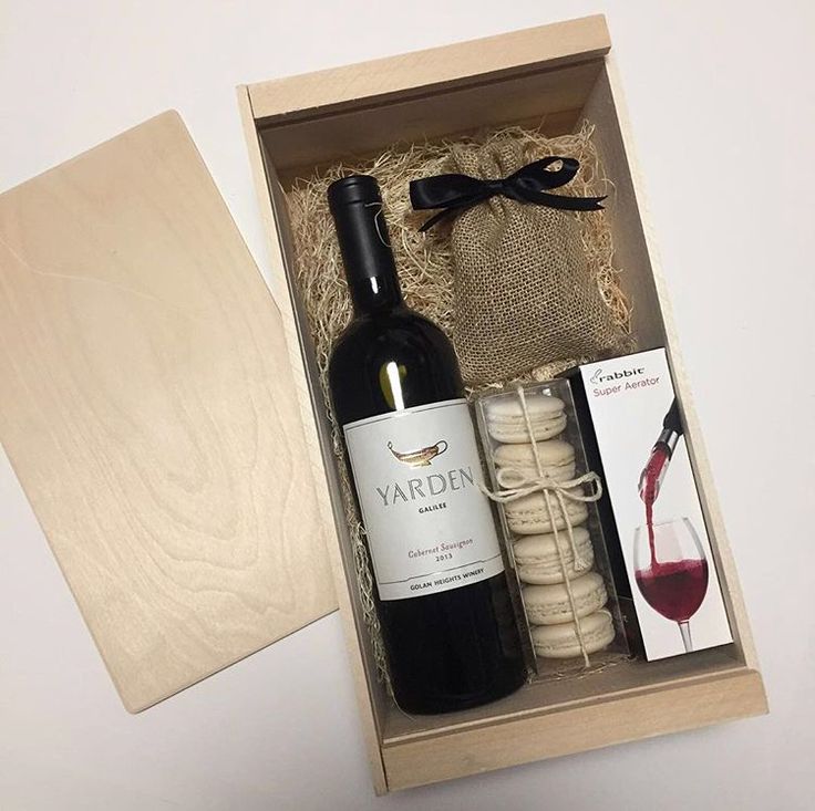 Corporate gift box with wine, French macarons, wine opener and chocolates