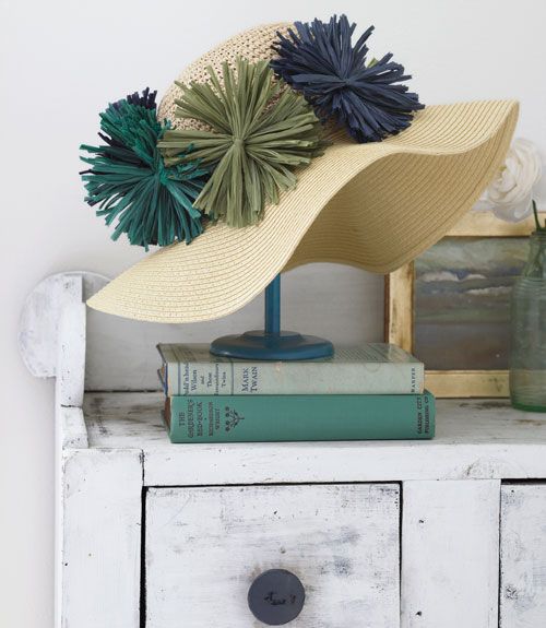 Boost even the most basic hat with a row of raffia flowers.