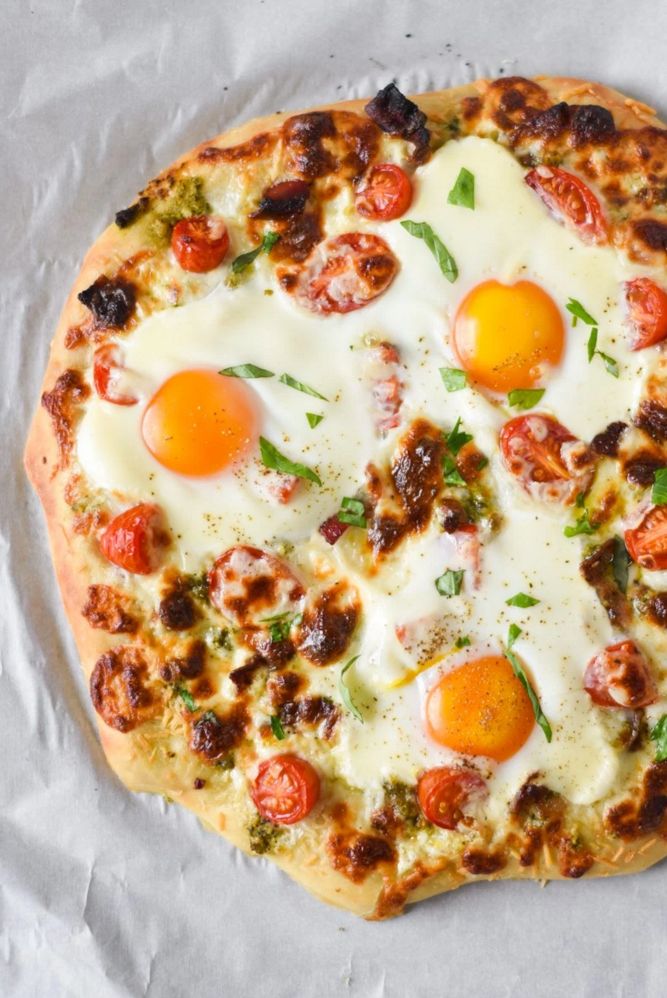 Breakfast Pizza is topped with fresh basil and layered with eggs .