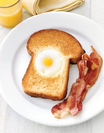 Egg-in-the-Hole begins with a thick slice of buttered brioche bread and is great...