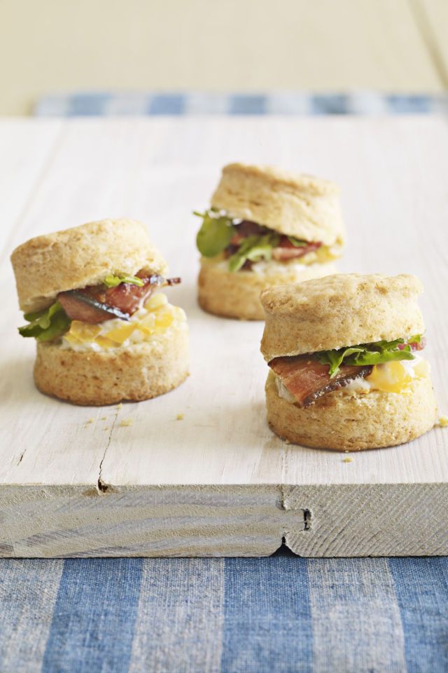 Enjoy a mini BLT by serving tomato, mayonnaise, lettuce, and bacon between soft ...