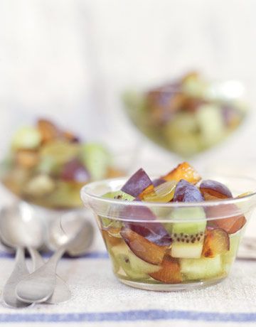Fruit Salad with Plums has pieces with honeydew melon, kiwi fruit, and sliced gr...