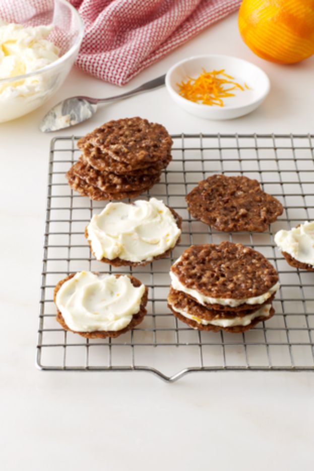Pecan Lace Cookie Sandwiches are thin nutty cookies filled with a citrusy inside...