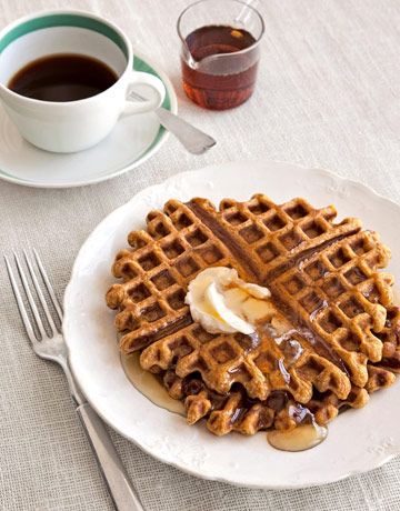 The unexpected punch of crystallized ginger gives tender pumpkin waffles a grown...