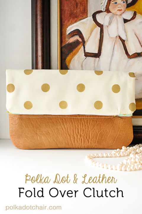 This fold-over clutch made with soft lambskin leather can be used as an evening ...