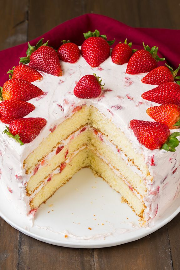 This fresh strawberry cake is layered with fresh strawberries and frosted with a...