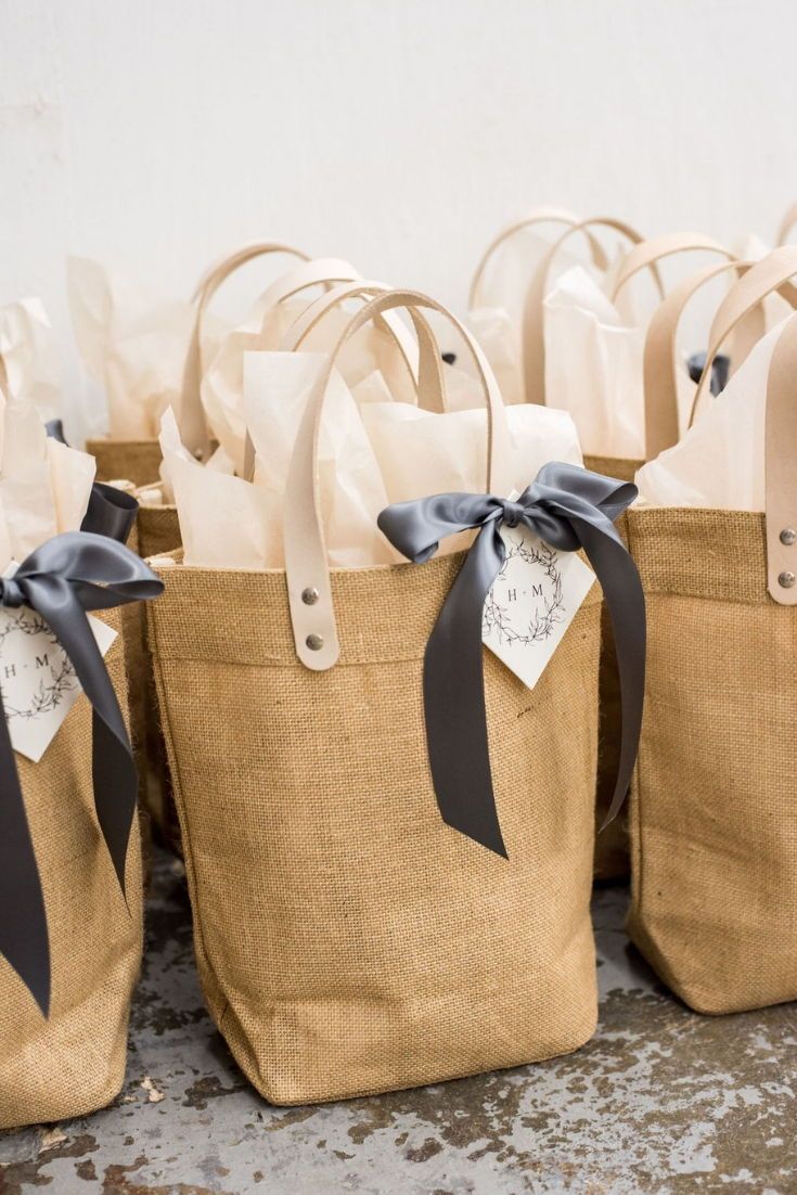 WEDDING WELCOME GIFTS// Cream and pewter canvas totes filled with local artisan ...