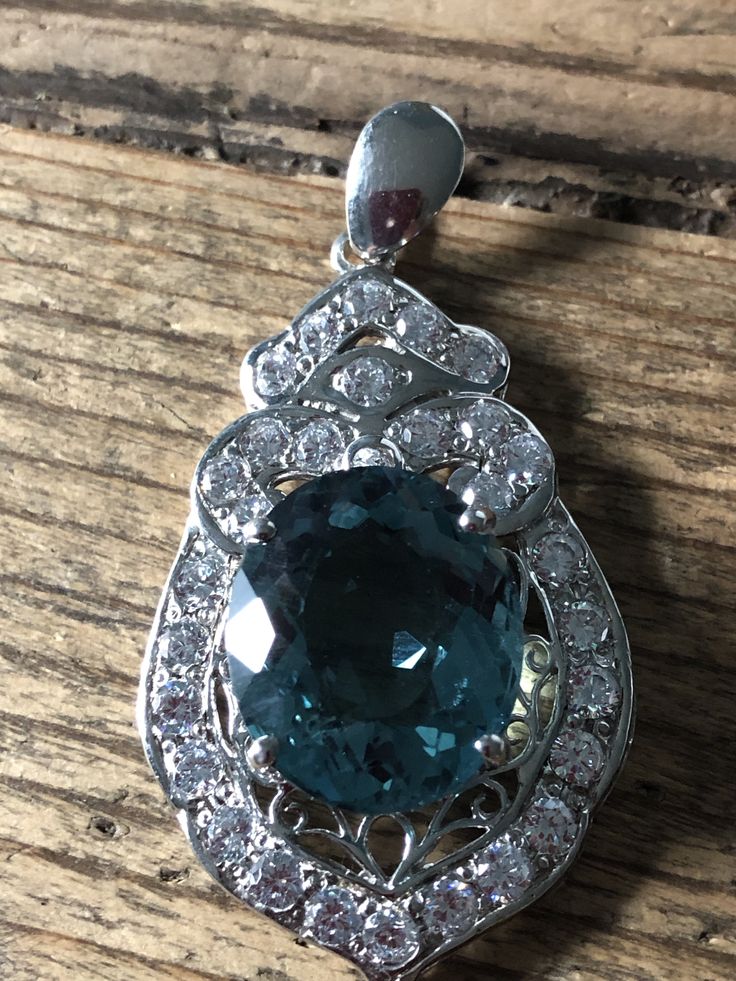A Natural 18.3CT Oval Cut Blue Aquamarine Halo White Sapphire Pendant Necklace