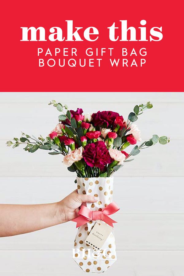 Instead of wrapping a present, use a paper gift bag to wrap a gorgeous bouquet o...
