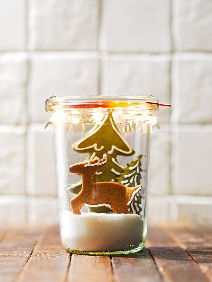 A Mason jar filled with sugar cookie trees and a reindeer is a sweet DIY mason j...